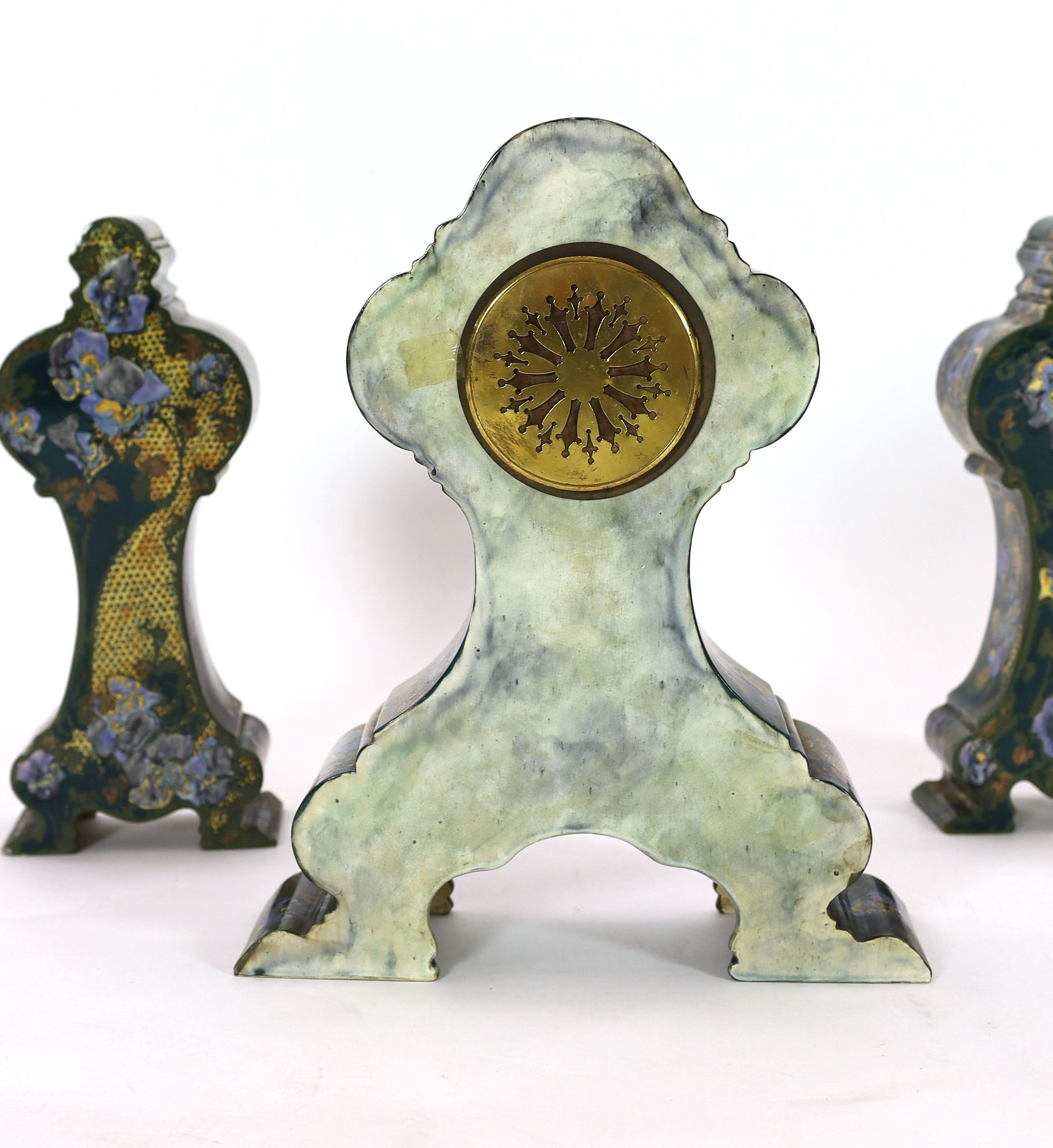 A Rozenberg Art Nouveau earthenware three piece clock garniture, clock 45 cm high